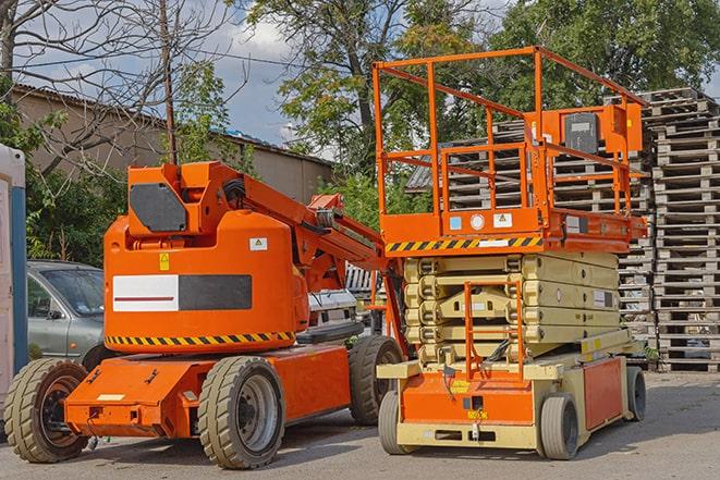 warehouse forklift in action with neatly arranged pallets in Box Elder SD